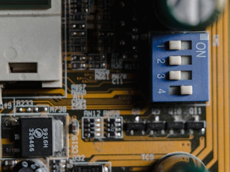 Detailed view of a circuit board showing switches and microchips.