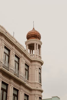 Capture of a historic building with a dome in Puebla, showcasing intricate architectural elegance.