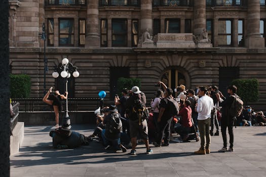 Energetic street performance with photographers capturing the moment outside Banco building.